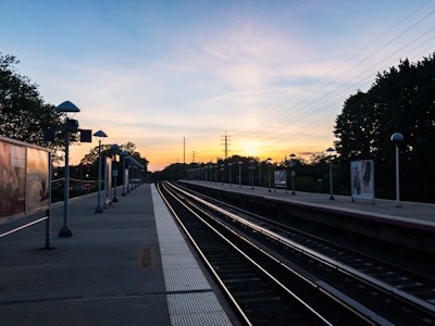 Sunset Over Train Platform and Tracks