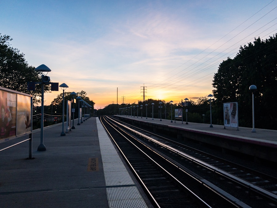 Photo: Sunset Over Train Platform and Tracks