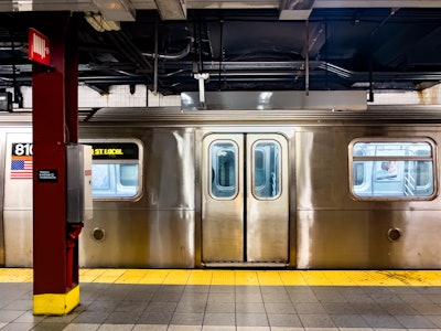 NYC Subway Station and Train - A subway platform with a double door train in the station
