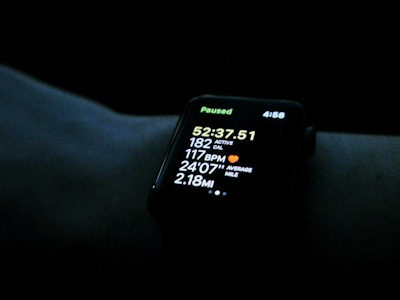 Apple Watch on Wrist - A smart watch with a screen showing time and running time