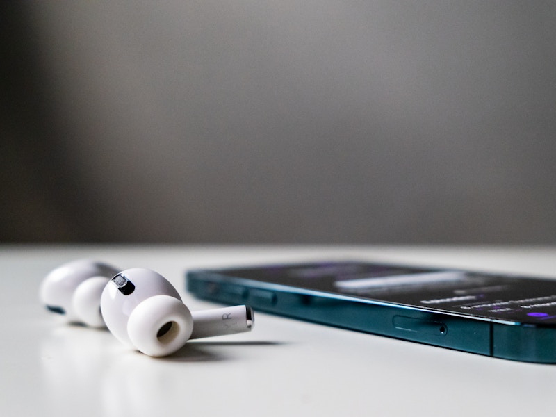 Photo: A phone and earbuds on a table