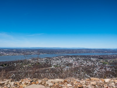 View from Mountain of a River, City, Bridge, and Blue Sky - A city and large body of water from a mountain