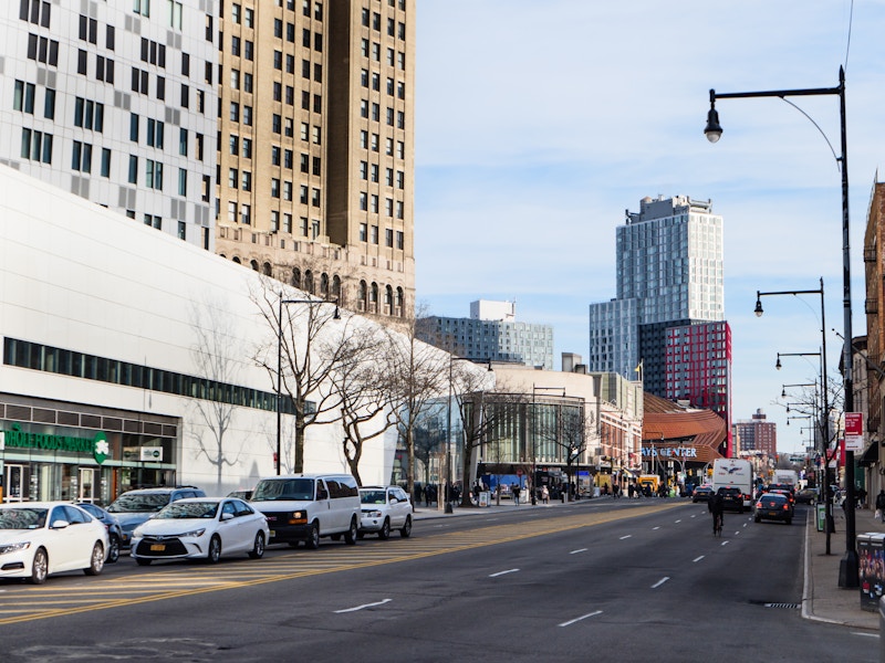 Photo: A city street with cars and buildings
