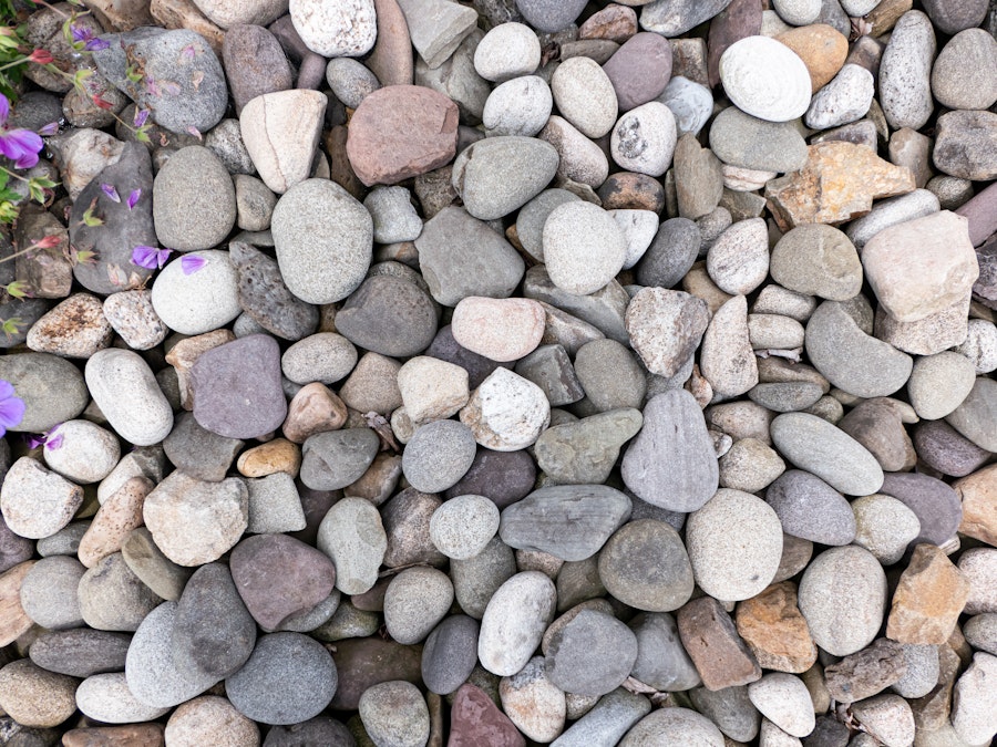 Photo: A group of gray and white rocks on the ground