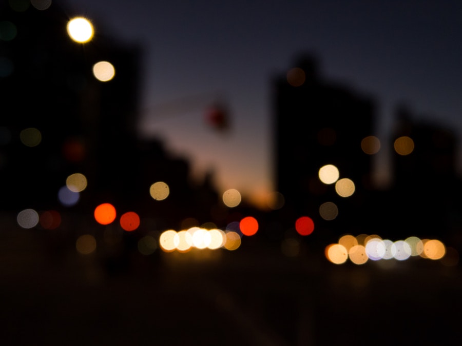 Photo: Blurry image of a city at night
