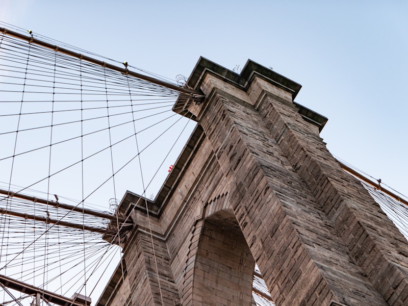 Photo: Looking up at a bridge with ropes attached to it