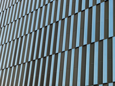 Building Windows - A close up of a geometric building with long rectangular windows 