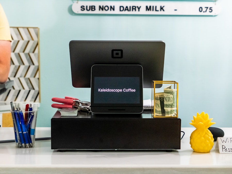 Photo: A register on a counter at a coffee shop 