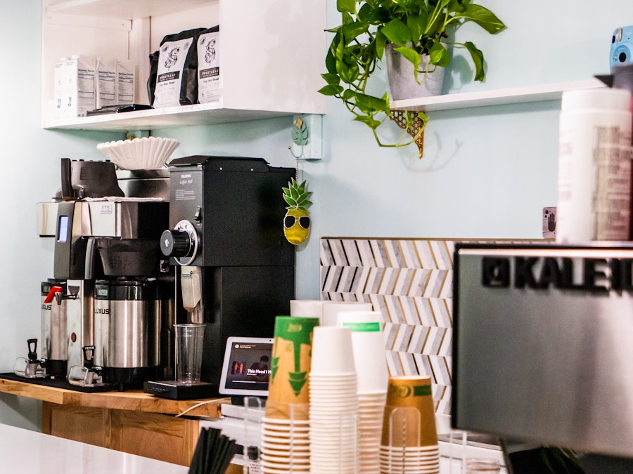 Photo: A coffee machine in a coffee shop with cups on the counter