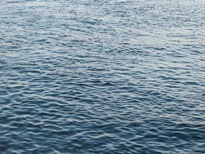 Ocean Water - A close up of a body of water with small waves