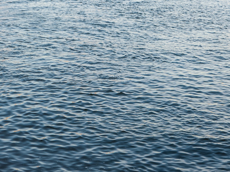 Photo: A close up of a body of water with small waves