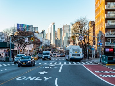 Brooklyn Street - A city street with cars and buses, surrounded by buildings