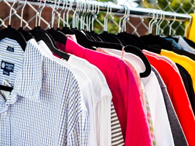 Clothing Rack of Shirts at a Market - A group of shirts on a metal clothing rack