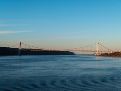 George Washington Bridge Over Water - A bridge over water with a large body of water