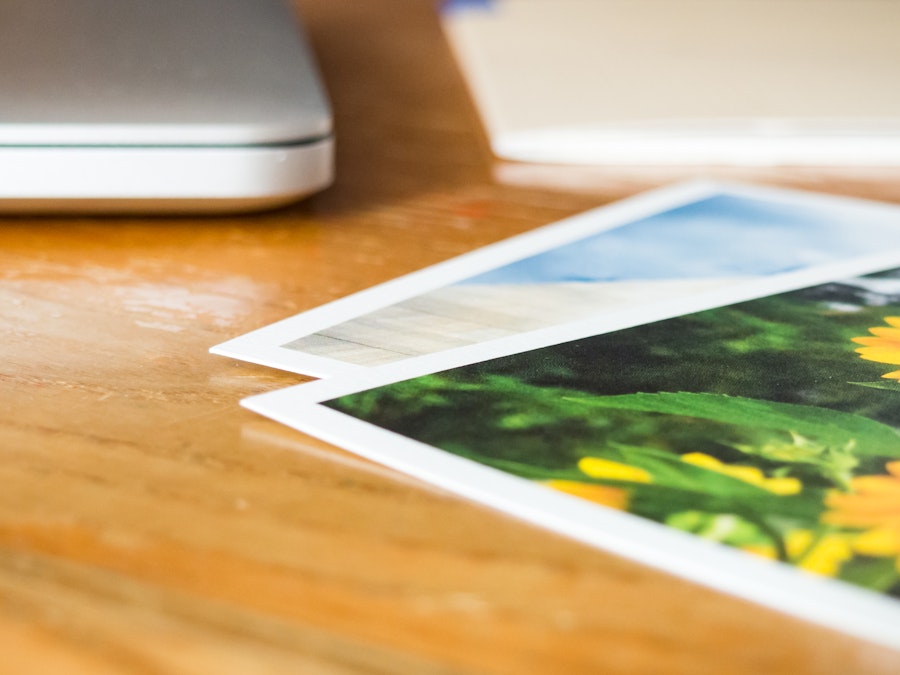 Photo: Desk with Laptop and Photos