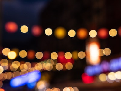 Blurred City Lights - A blurry image of blue, red, yellow, and orange lights