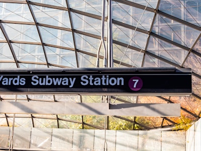 Manhattan Subway Station Entrance - A sign at the entrance to a subway station