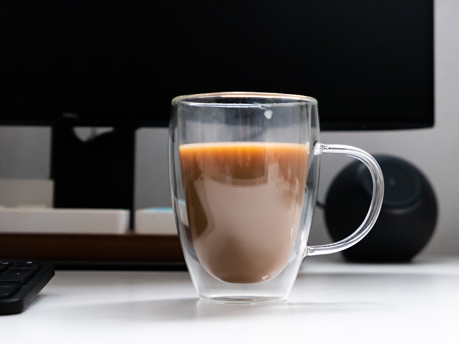 Photo: A glass cup with coffee in it