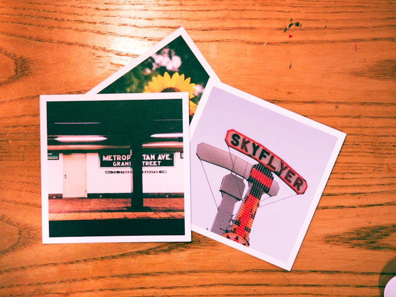 Photo: Photo Prints on Wooden Desk