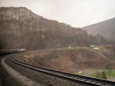 Train Crossing Tracks with Snow