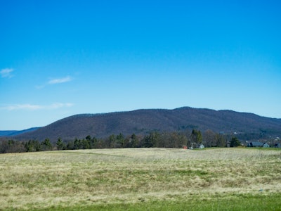 Landscape Under Blue Sky and Mountains