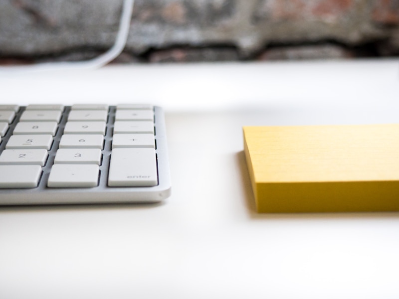 Photo: Desk with Keyboard and Notepad
