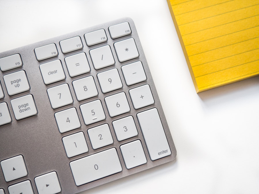 Photo: Keyboard and Notepad on Desk