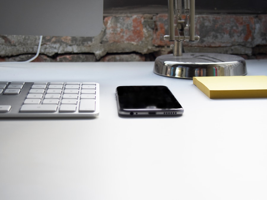 Photo: Computer and Phone on Desk