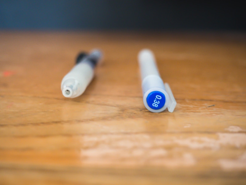 Photo: Pens on Wooden Desk