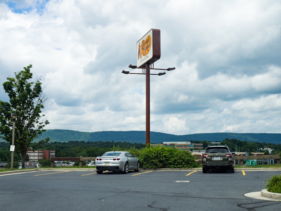 Photo: Parking Lot Overlooking Highway and Mountains