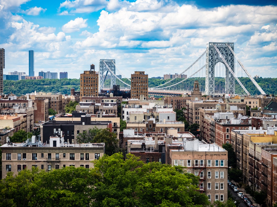 Photo: A city with a bridge in the background