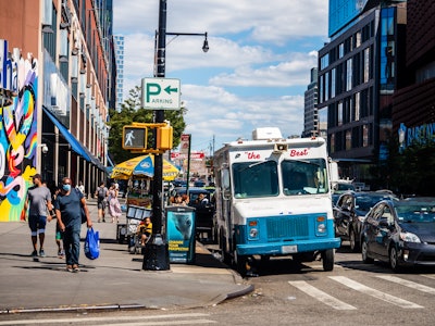 Ice Cream Truck and People on Brooklyn Street - An ice cream truck on a city street