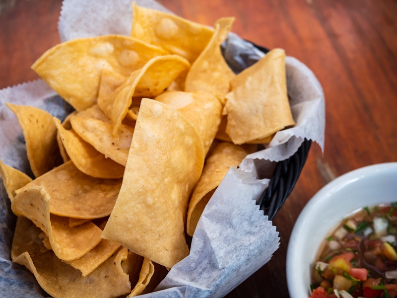 Photo: A bowl of chips and salsa on a table