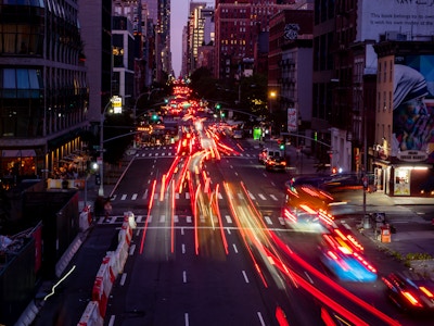 Cars on Manhattan Street at Night Long Exposure - A city street with cars and lights at long exposure 