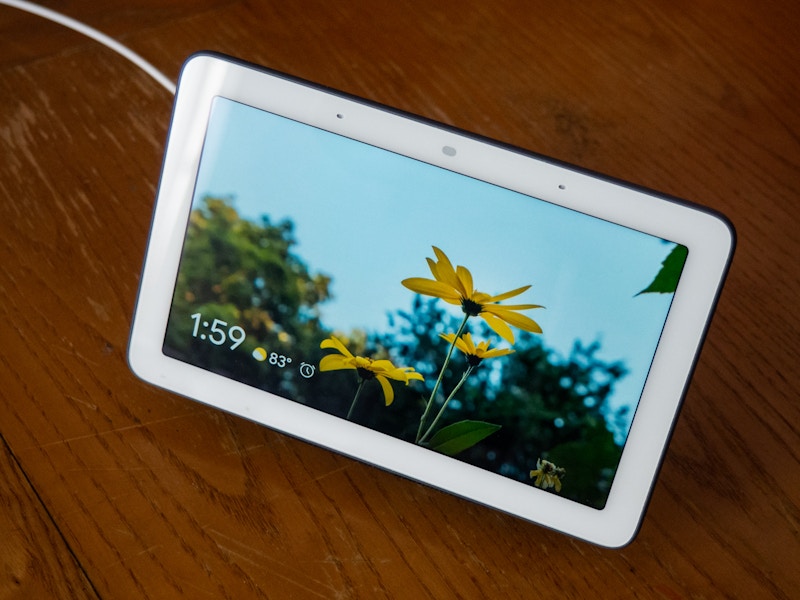 Photo: A smart home display with a picture of yellow flowers on it