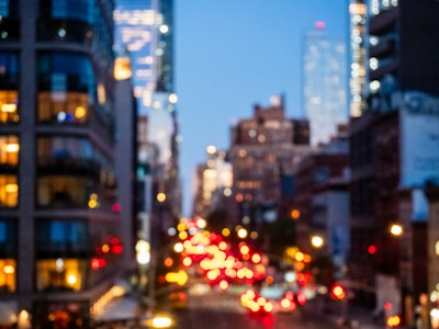 City Street Bokeh - A blurry image of a city street and buildings