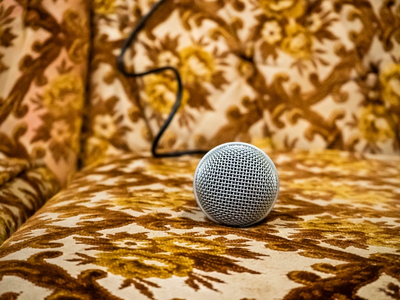 Photo: A close up of a microphone on a couch
