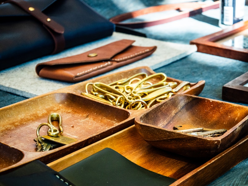 Photo: Trays of metal objects and wallets at an artist market
