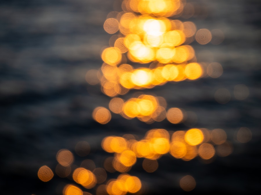 Photo: A blurry image of a body of water during sunset