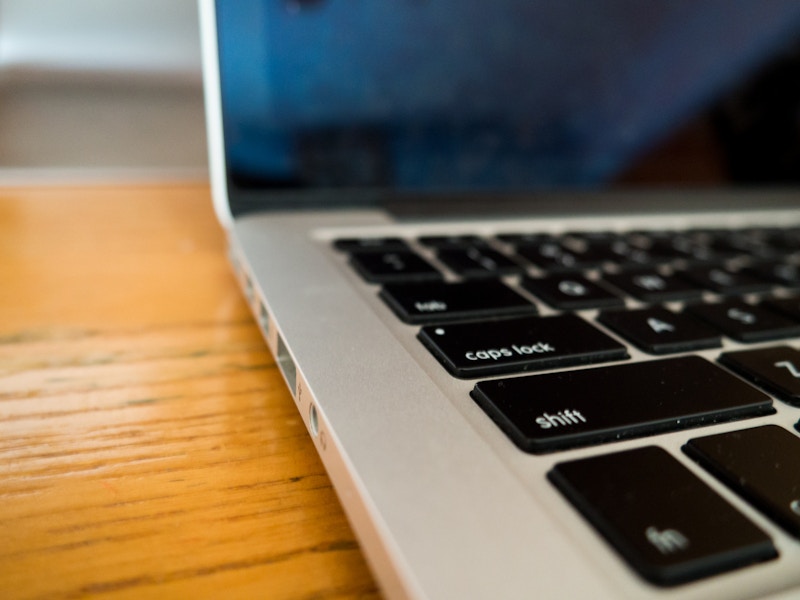 Photo: Laptop on Wooden Desk with Keyboard