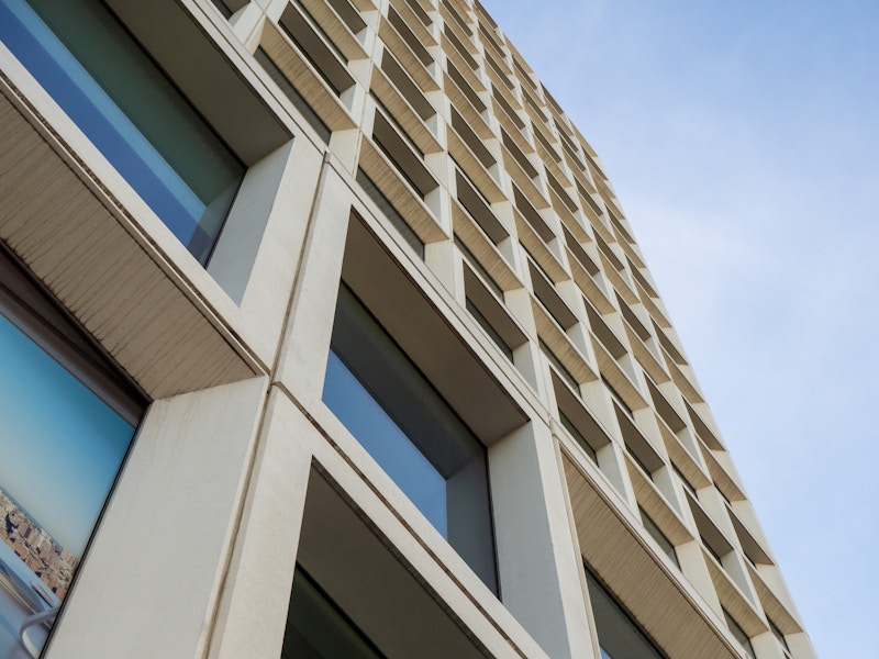 Photo: A low angle view of a building with many windows