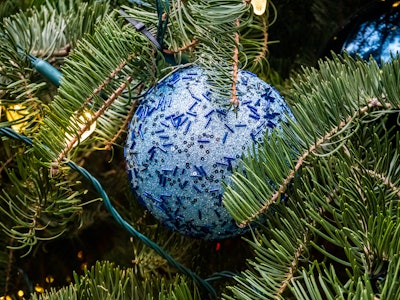 Ornament on Christmas Tree - A blue ornament on a Christmas tree