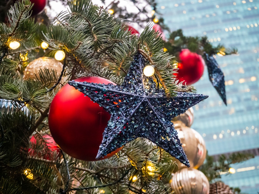 Photo: A Christmas tree with a star and ornaments