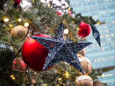 Star Ornament on Christmas Tree - A Christmas tree with a star and ornaments