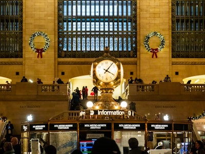 Grand Central Terminal Clock - Clock at Grand Central Terminal Information Booth with Christmas wreaths in the background