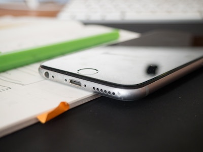 Open Notebook and Phone on Desk